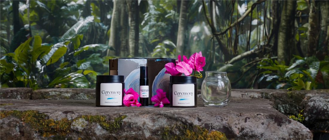 The four Ceremony products photographed together on jungle stone.